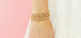 Bow Gold Charm Bracelet