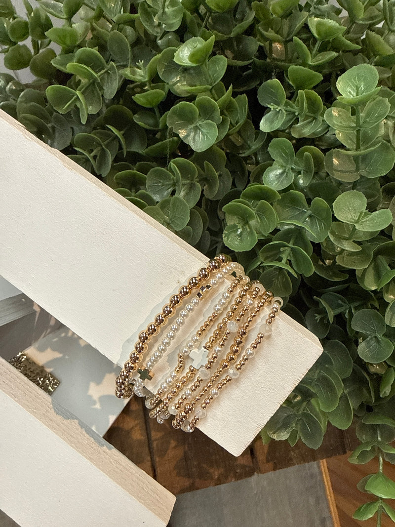 Set Of 7 Pearl & Gold With White Cross Stretch Bracelets